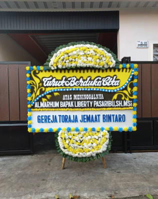 Papan Bunga Duka di Purnama